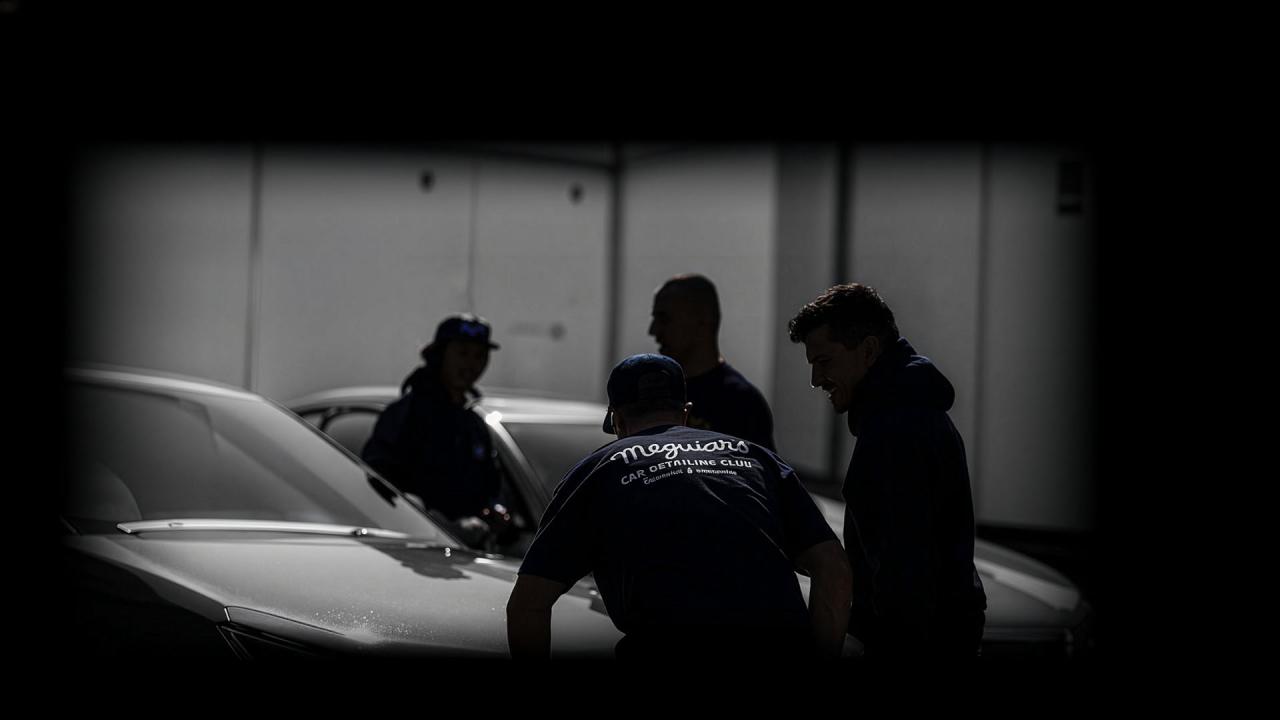 Shadowy figures detailing cars