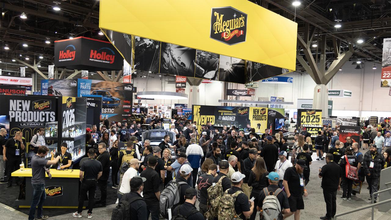 Photo of the Meguiar's booth at SEMA Show 2024 with a crowd of people around it