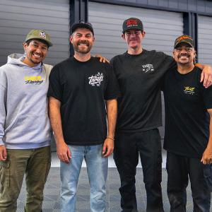 The Throtl team standing together in a garage