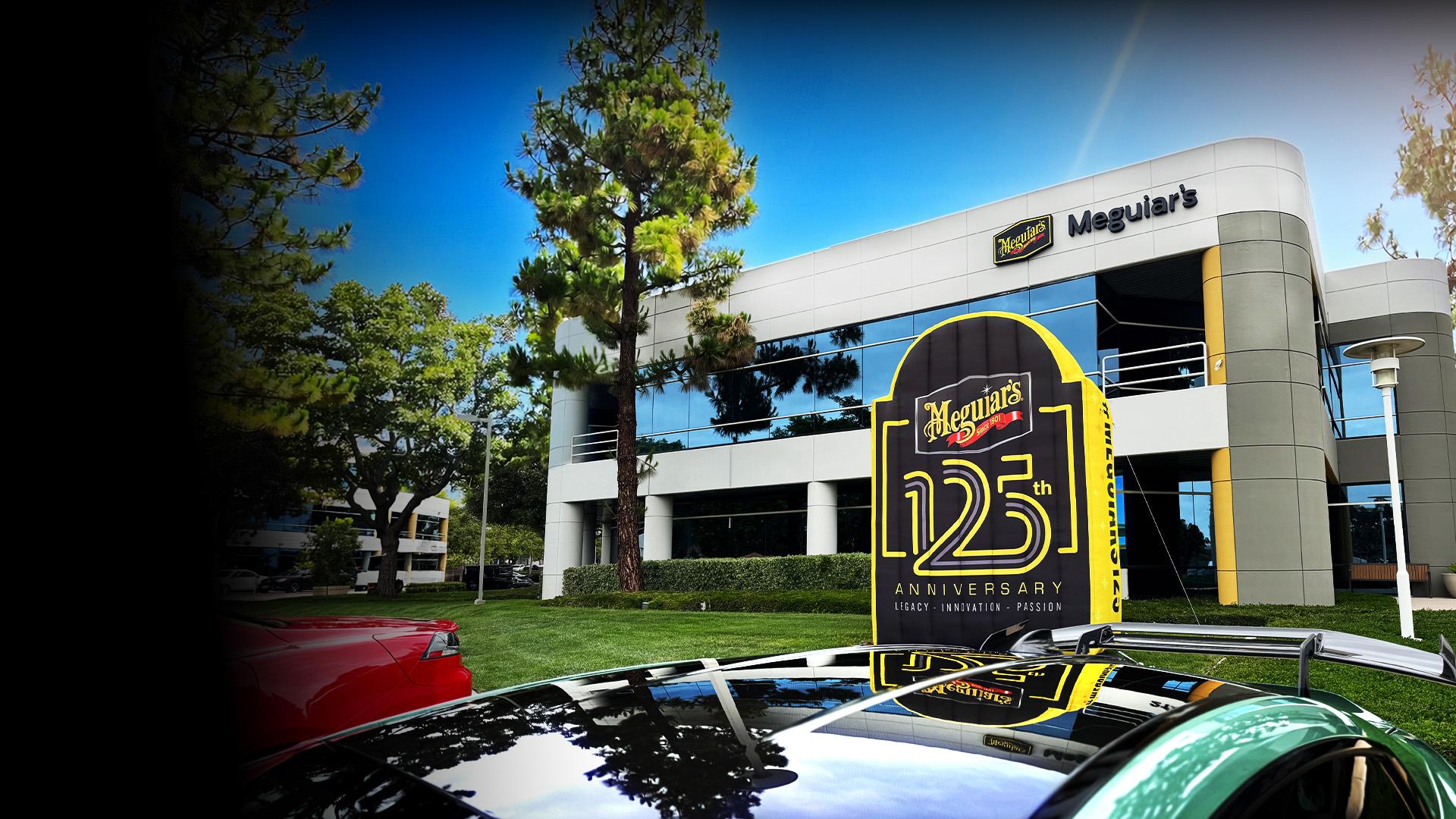 Meguiar's headquarters building with a 125 year anniversary blow up in front